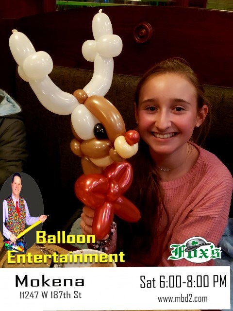 girl with reindeer stick balloon 