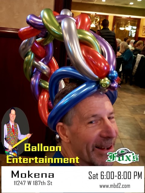 man with braided balloon hat